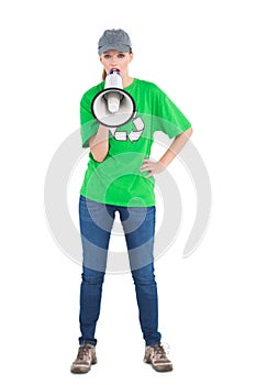 Motivated pretty environmental activist yelling in a megaphone