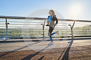 Motivated woman going running in open air