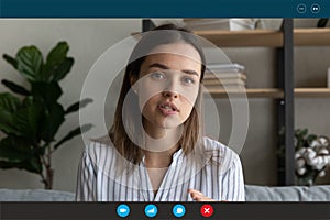 Motivated woman talk on video call from home photo