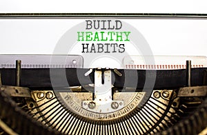 Motivation Build healthy habits symbol. Concept words Build healthy habits on white paper typed on old retro typewriter on