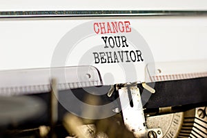 Motivation Change your behavior symbol. Concept words Change your behavior on white paper typed on old retro typewriter on
