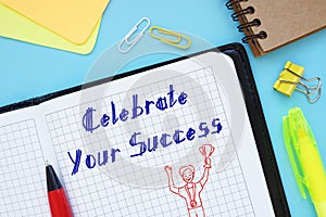 Motivation concept about Celebrate Your Success with phrase on the piece of paper