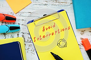 Motivation concept meaning Avoid Interruptions with inscription on the sheet