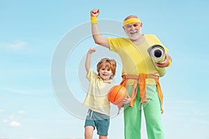 Motivation and sport concept. Sport exercise for kids. Grandfather and son doing exercises. I love sport. Outdoor