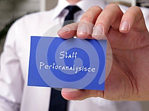 Motivational concept meaning Staff Perforanalysisce with inscription on the piece of paper