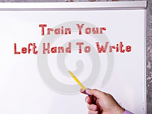 Motivational concept about Train Your Left Hand To Write with sign on the piece of paper