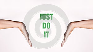 Motivational horizontal poster. Women& x27;s hands in a pointing gesture. Green motivating inscription & x27;Just Do