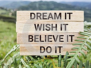 Motivational and inspirational quote of dream it wish it live it text background. Stock photo.