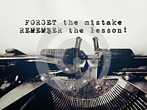 Motivational and inspirational quote of forget the mistake, remember the lesson in vintage background. Stock photo.