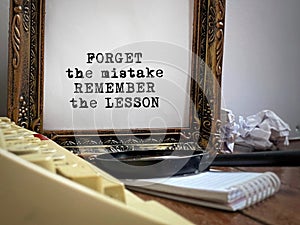 Motivational and inspirational quote of forget the mistake, remember the lesson in vintage background. Stock photo.