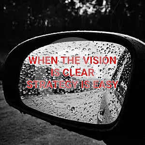 Motivational quote with blurry background. When the vision is clear stratergy is easy.