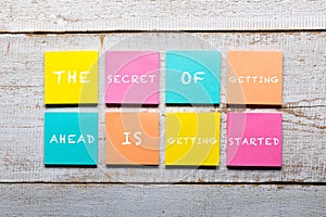 Motivational quote on colorful sticky notes