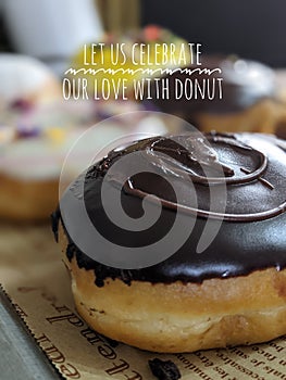 motivational quote with doughnut blurred background.  let us celebrate our love with donut