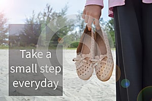 Motivational quote written with Take A Small Step Everday