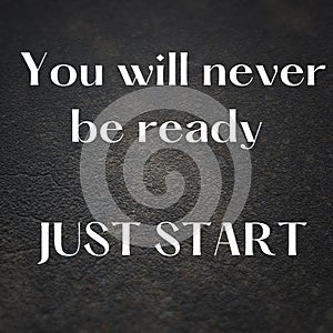 Motivational quote "You will never be ready, just start" on concrete surface background