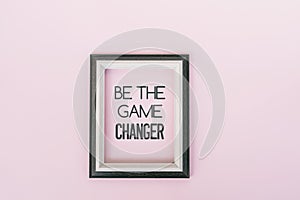 Motivational quotes - Be the game changer. Pink backgrounds