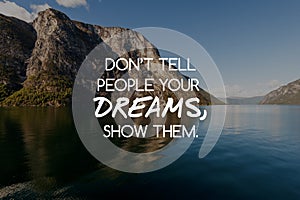 Motivational quotes - Don`t tell them your dreams, show them. Blurry background