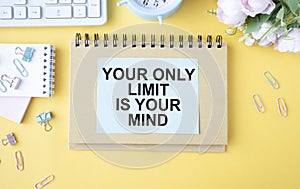 motivational quotes on a white plate, your only limit is your mind against a yellow background