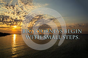 Motivational sign: Big journeys begin with small steps