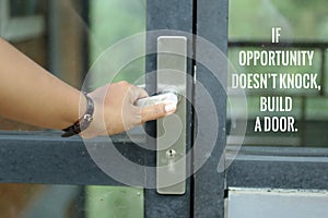 Motivational words on door glass - If opportunity does not knock, build a door. With a person entering the door.