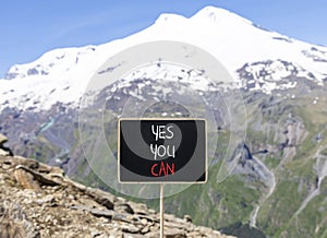 Motivational and Yes you can symbol. Concept words Yes you can on beautiful black chalk blackboard. Beautiful mountain Elbrus