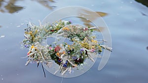 A motley grass wreath on the water