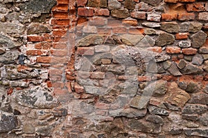 Motley masonry at the base of the house