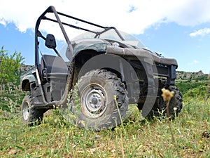 Moto all-terrain vehicle in mountains