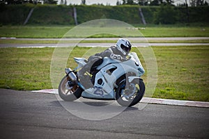 Moto-athlete on the racetrack