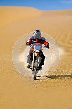 Moto racer in desert