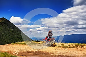 Moto racers riding on mountainous road, drive a motorcycle