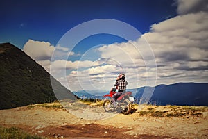 Moto racers riding on mountainous road, drive a motorcycle