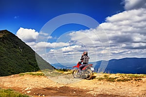 Moto racers riding on mountainous road, drive a motorcycle photo
