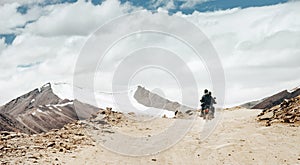 Motobike travelers ride on mountain pass road in indian Himalaya photo