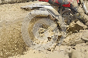 Motocross accelerating speed in mud