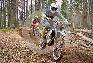 Motocross drivers in competition on the race track