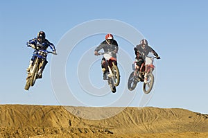 Motocross Male Racers Racing Against Sky