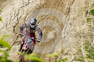 Motocross. Motorcyclist rushes along a dirt road.