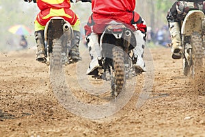 Motocross racer accelerating speed in track