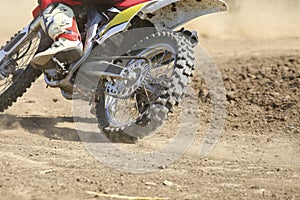 Motocross racer accelerating speed in track