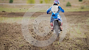 Motocross racer start riding his dirt Cross MX bike