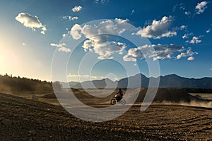 Motocross ride on dry dirt track full of dust