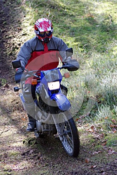 Motocross rider in dirt path