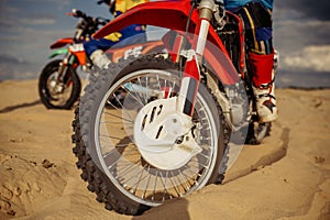 Motocross rider on extreme desert terrain track photo
