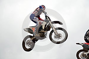 Motocross rider flies through air