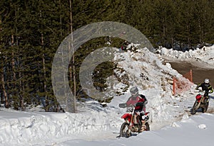Motocross rider on a motorcycle on the race track in winter in the city of Noyabrsk, Yamalo-Nenets Autonomous District