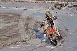 Motocross rider performs a right turn with