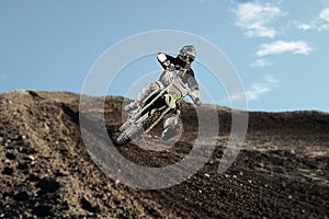 Motocross rider on race track