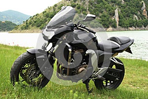 Motor bike parked in a field