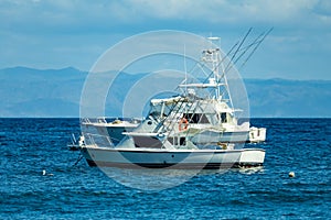 Motor boat anchored on Ocotal beach, Pacific ocean, El Coco Costa Rica